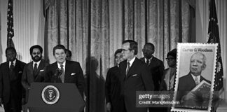 FLASHBACK - Late Republican President Ronald Reagan unveils postage stamp of Carter Woodson (father of black history) at a White House Ceremony marking the observance of National Afro-American (Black) History Month, Washington DC, February 2, 1984.