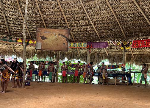 Embera dancers and musicians perform for tourist at their village up the Chagres River in Panama. (NewsAmericasNow.com image)