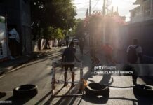 Caribbean Ingenuity In Pictures: How Haiti & Cuba Are Adapting Through Crisis Young boys play football with makeshift gear in Delmas, Port-au-Prince, Haiti, on March 22, 2026.