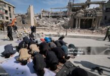 US Seeks Forfeiture Of Oil Tanker Flying False Guyana Flag A group of Iranian men prays in an area that is targeted in U.S.-Israeli attacks in Tehran, Iran, on March 4, 2026.