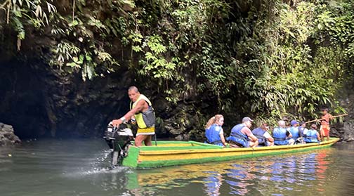 Embera boat men maneuver to the falls up the Chagres River in Panama. (NewsAmericasNow.com image)